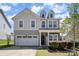 Beautiful two-story home with a cozy front porch, attached garage, and lovely curb appeal at 2220 Atwell Glen Ln, Pineville, NC 28134