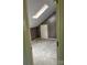 Attic space with wood paneled walls, skylight window, and carpeted floors at 2417 Lynwood Dr, Lancaster, SC 29720