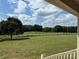 Beautiful backyard view of green lawn and white fence under a partly cloudy blue sky at 2417 Lynwood Dr, Lancaster, SC 29720
