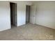Large bedroom with carpeted flooring, neutral walls, and access to bathroom offering comfort and privacy at 2417 Lynwood Dr, Lancaster, SC 29720