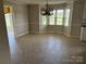 Dining area with ceramic tile floors, bay window, and a decorative chandelier at 2417 Lynwood Dr, Lancaster, SC 29720