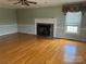 Bright living room with fireplace, hardwood floors and large window at 2417 Lynwood Dr, Lancaster, SC 29720