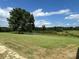 Picturesque pond surrounded by lush greenery and trees, offering a serene and peaceful setting at 2417 Lynwood Dr, Lancaster, SC 29720