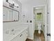 Bright bathroom featuring a modern vanity, toilet, and tiled floors at 2805 Bathgate Ln, Matthews, NC 28105