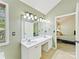 Bright bathroom featuring a large mirror, double vanity with marble countertop, and tile floors at 2805 Bathgate Ln, Matthews, NC 28105