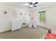 A bedroom with a teepee, books, dresser, and crib at 2805 Bathgate Ln, Matthews, NC 28105