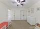 A bedroom with a crib, dresser, closet and neutral colors at 2805 Bathgate Ln, Matthews, NC 28105