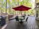 Spacious deck with patio furniture and grill, ideal for outdoor gatherings and enjoying nature at 2805 Bathgate Ln, Matthews, NC 28105