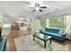 Open-concept living area with hardwood floors flowing into the kitchen and dining, perfect for entertaining at 2805 Bathgate Ln, Matthews, NC 28105