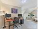 A large, carpeted office with a desk, monitors, an office chair, and a tv at 2805 Bathgate Ln, Matthews, NC 28105