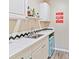 Charming wet bar area with a mini-fridge, sink, and Red Wings decor adding character at 2805 Bathgate Ln, Matthews, NC 28105