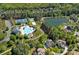 Aerial view features community pool, lake, tennis courts, and homes at 3060 Drummond Ave, Indian Land, SC 29707