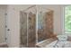 Elegant bathroom with tiled shower, soaking tub, and modern fixtures at 3060 Drummond Ave, Indian Land, SC 29707