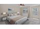 Neutral bedroom features a large window, trey ceiling with ceiling fan, and ample space at 3060 Drummond Ave, Indian Land, SC 29707