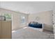 Bright bedroom with a blue daybed, two windows, and neutral walls at 3060 Drummond Ave, Indian Land, SC 29707
