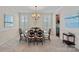 Formal dining room with elegant chandelier and view into the kitchen at 3060 Drummond Ave, Indian Land, SC 29707
