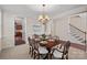 Elegant dining room featuring a chandelier, hardwood floors, and wainscoting at 3060 Drummond Ave, Indian Land, SC 29707