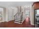 Open foyer with hardwood floors, staircase, and decorative lighting at 3060 Drummond Ave, Indian Land, SC 29707