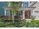 Charming home featuring a column-lined front porch, colorful shrubs, and a landscaped front yard at 3060 Drummond Ave, Indian Land, SC 29707