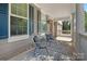 Charming front porch with outdoor seating, a rug, and stylish columns at 3060 Drummond Ave, Indian Land, SC 29707