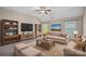 Comfortable living room featuring neutral colors, carpeted floor and built in shelving at 3060 Drummond Ave, Indian Land, SC 29707