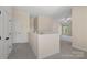 Bright loft space features neutral walls, plush carpeting, and ample natural light from the window at 3060 Drummond Ave, Indian Land, SC 29707