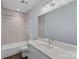 Stylish bathroom with modern vanity, patterned tile accent wall, and shower-over-tub design at 310 Wesley Heights Way, Charlotte, NC 28208