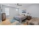 Comfortable bedroom with natural light, a ceiling fan, and stylish furnishings at 310 Wesley Heights Way, Charlotte, NC 28208