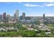 Skyline view showcasing urban architecture, stadium, and lush greenery at 310 Wesley Heights Way, Charlotte, NC 28208
