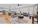 Spacious living area with an open floor plan that showcases the modern kitchen and comfortable seating at 310 Wesley Heights Way, Charlotte, NC 28208