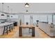 Spacious living area with an open floor plan that showcases the modern kitchen and comfortable seating at 310 Wesley Heights Way, Charlotte, NC 28208