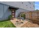 Cozy patio area with outdoor seating, potted plants, and privacy fencing, perfect for relaxation at 310 Wesley Heights Way, Charlotte, NC 28208