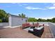 Inviting rooftop deck featuring stylish patio furniture and a brick paver floor at 310 Wesley Heights Way, Charlotte, NC 28208