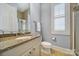 Updated bathroom with natural stone countertops, a walk-in shower, and natural light at 374 Horton Grove Rd, Fort Mill, SC 29715