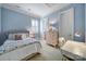 Comfortable bedroom with blue walls, natural light, carpet, a desk, and a private ensuite at 374 Horton Grove Rd, Fort Mill, SC 29715