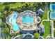 Aerial view of community pool with lap lanes, a lazy river, lounging areas and mature landscaping at 374 Horton Grove Rd, Fort Mill, SC 29715