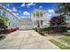 Charming two-story home with a spacious three-car garage, manicured landscaping, and a welcoming front porch and balcony at 374 Horton Grove Rd, Fort Mill, SC 29715