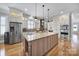 Spacious kitchen with large island, stainless steel appliances, custom cabinetry, and hardwood floors at 374 Horton Grove Rd, Fort Mill, SC 29715