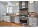 Modern kitchen featuring stainless steel appliances, granite countertops, subway tile backsplash and a gas cooktop at 374 Horton Grove Rd, Fort Mill, SC 29715