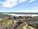 Gorgeous aerial shot of the neighborhood featuring expansive lake views and lush trees in the landscape at 4 Hummingbird Ct, Clover, SC 29710