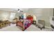 A cozy bedroom features a wooden bed frame, a seating area, and neutral-toned walls at 4 Hummingbird Ct, Clover, SC 29710
