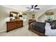 Bedroom with a dark wooden bed frame, dresser, and bright natural light at 4 Hummingbird Ct, Clover, SC 29710
