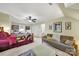 Spacious bedroom featuring carpet, a ceiling fan, a sofa, and bright natural lighting at 4 Hummingbird Ct, Clover, SC 29710