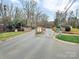 Welcoming entrance to the community featuring stone signage and meticulously landscaped grounds at 4 Hummingbird Ct, Clover, SC 29710
