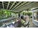 Undercover deck with a wooden table and chairs perfect for relaxing outdoors at 4 Hummingbird Ct, Clover, SC 29710