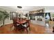 Elegant dining area with hardwood floors, fireplace view and chandelier for intimate dining experiences at 4 Hummingbird Ct, Clover, SC 29710