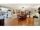 Elegant dining room with a large table, chandelier, hardwood floors, and tasteful decor at 4 Hummingbird Ct, Clover, SC 29710