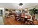 Formal dining room with a chandelier, hardwood floors, and sophisticated decor for memorable gatherings at 4 Hummingbird Ct, Clover, SC 29710