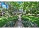 Inviting home with a manicured lawn and walkway leading to a charming front porch at 4 Hummingbird Ct, Clover, SC 29710