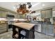 Fully equipped kitchen with stainless steel appliances, a center island, and overhead pot rack at 4 Hummingbird Ct, Clover, SC 29710